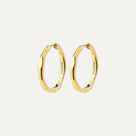 A pair of gold-plated wavy hoop earrings with the brand name 'PILGRIM' engraved on the inside, shown against a plain white background.