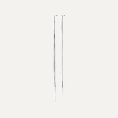 Two metallic poles on a white background