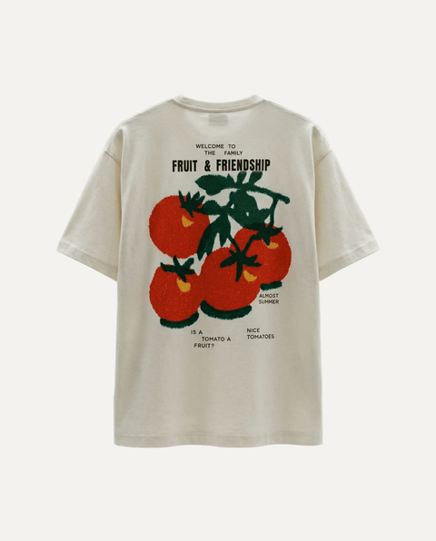 Beige t-shirt with tomato graphic and text on a white background