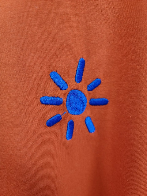 blue sun on dark orange organic cotton unisex tshirt te koop bij Almost Summer Amsterdam 11044