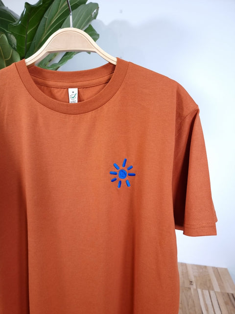 blue sun on dark orange organic cotton unisex tshirt te koop bij Almost Summer Amsterdam 11044