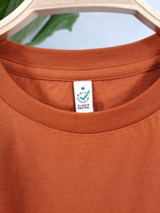 blue sun on dark orange organic cotton unisex tshirt te koop in de webshop van Almost Summer Amsterdam