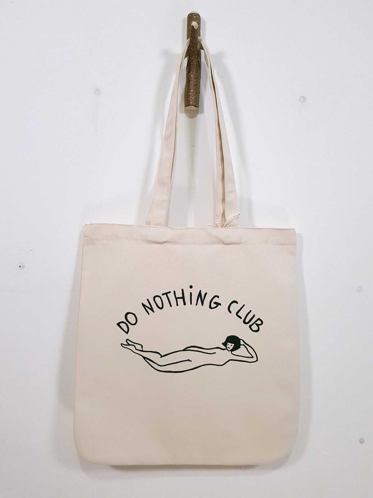 DO Nothing girl organic cotton premium tote bag te koop in de webshop van Almost Summer Amsterdam